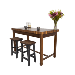 A butcher block kitchen island with seating around it and decor on top.