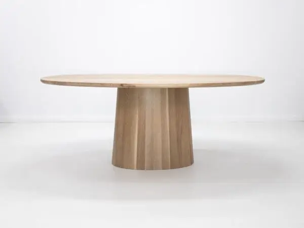 Oval wooden table with pedestal base.