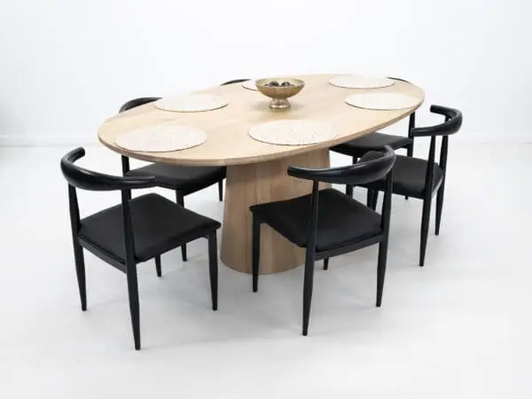 Our CATE, pedestal base, dining table with decor on top.