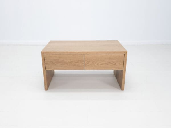 A coffee table with drawers.