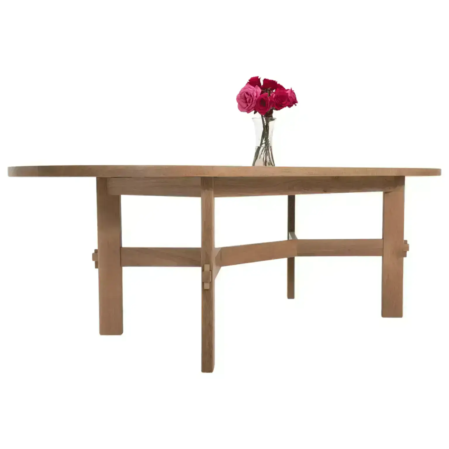 A dining table with flowers on top of it