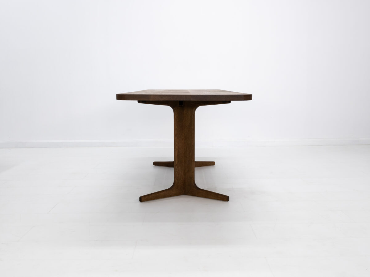 Close up of BRIA tables softly rounded corners and splayed feet
