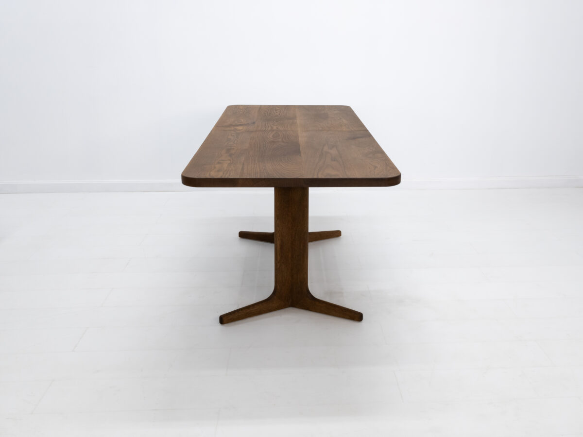 Close up of BRIA tables softly rounded corners and splayed feet