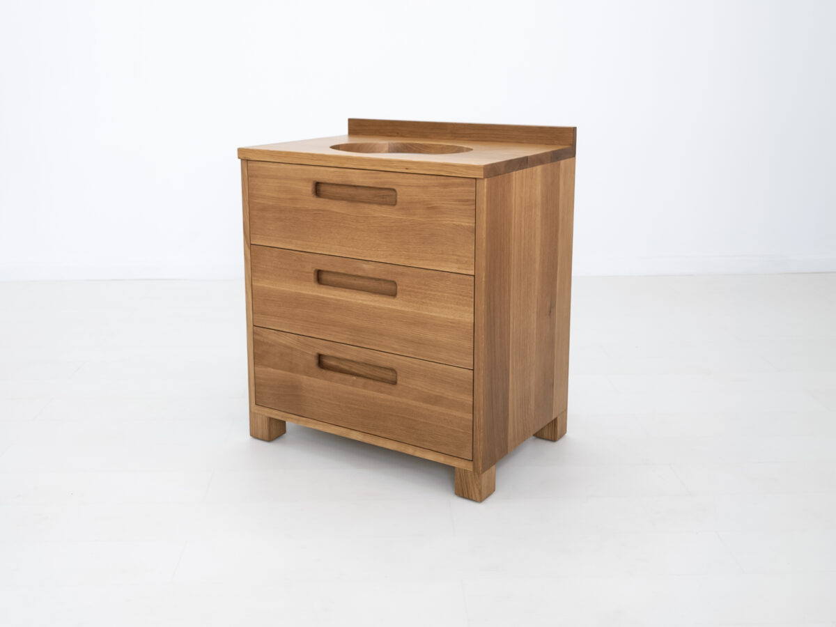 Modern white oak bathroom vanity featuring dovetail joinery and recessed pulls