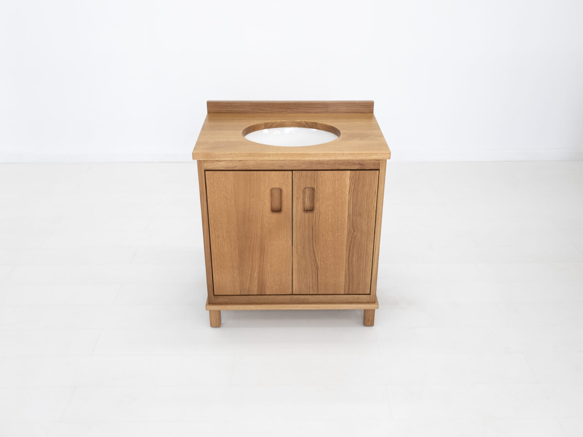 Custom rift sawn white oak vanity with solid wood top and soft close hardware