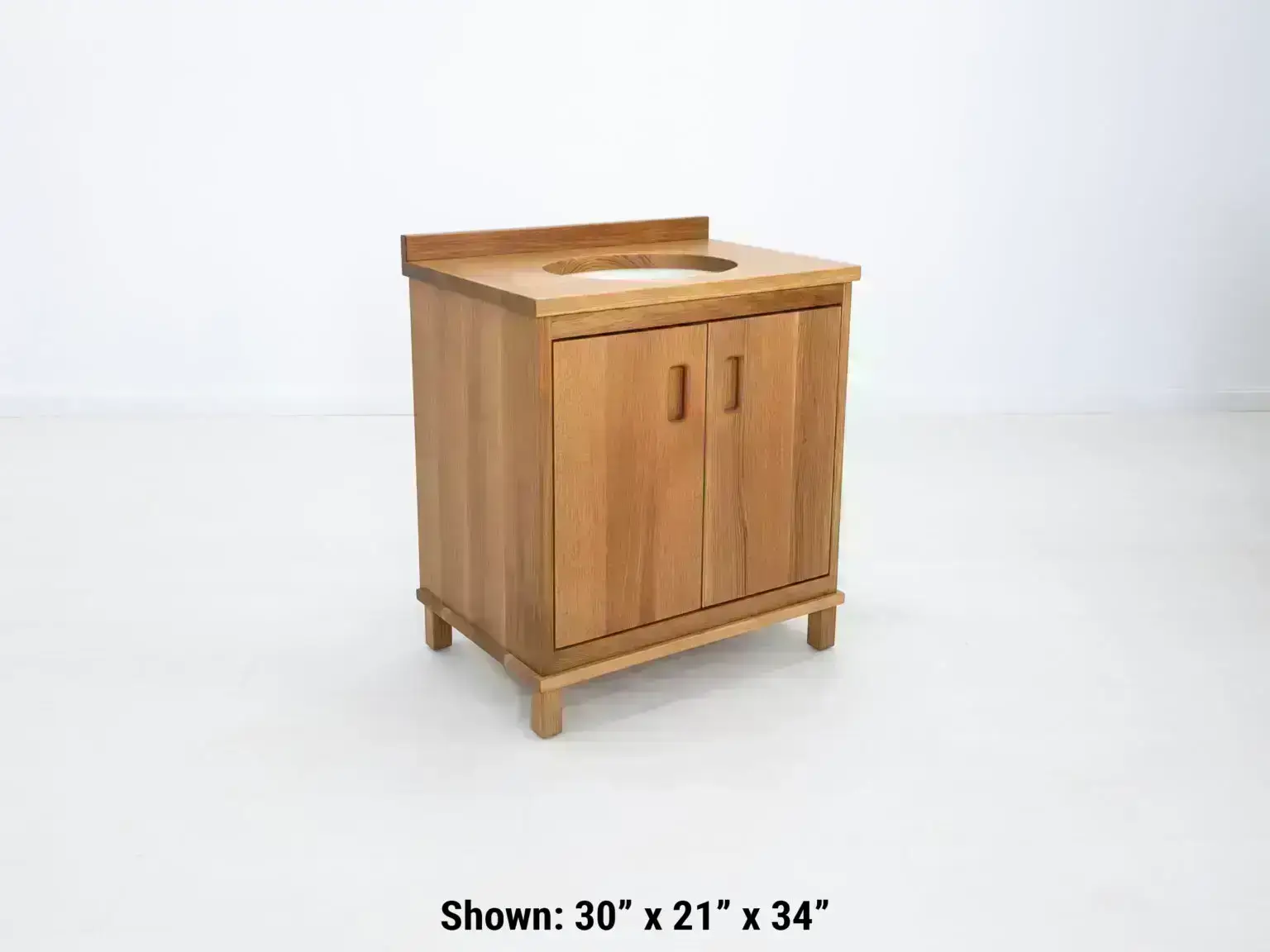 A rift sawn white oak vanity with 2 doors and ample storage