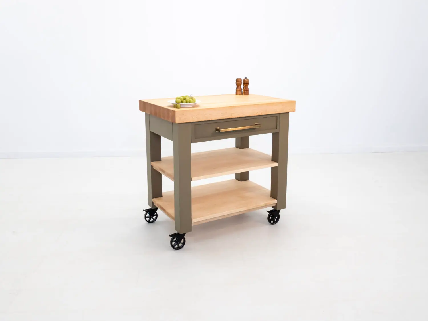 Side view of the CHEF kitchen cart with a spacious utensil drawer and flat black Top Knobs Ascendra pull