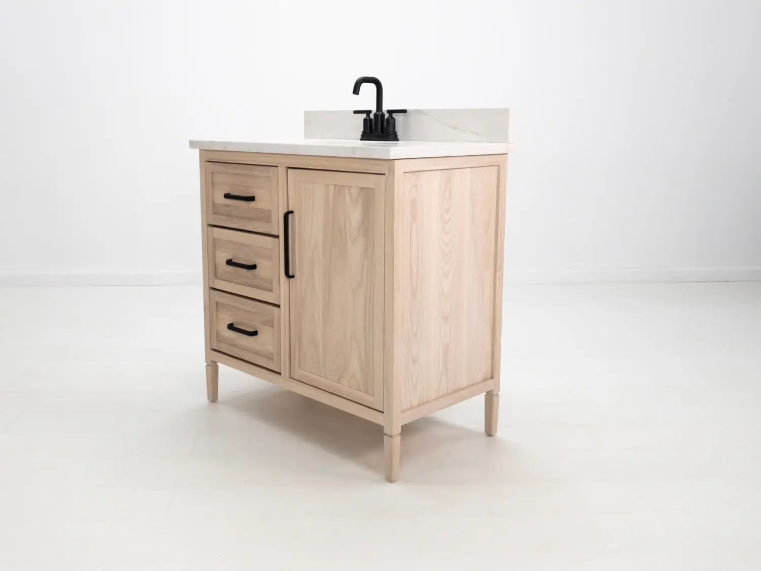 Custom solid wood bathroom vanity with black hardware and a refined design