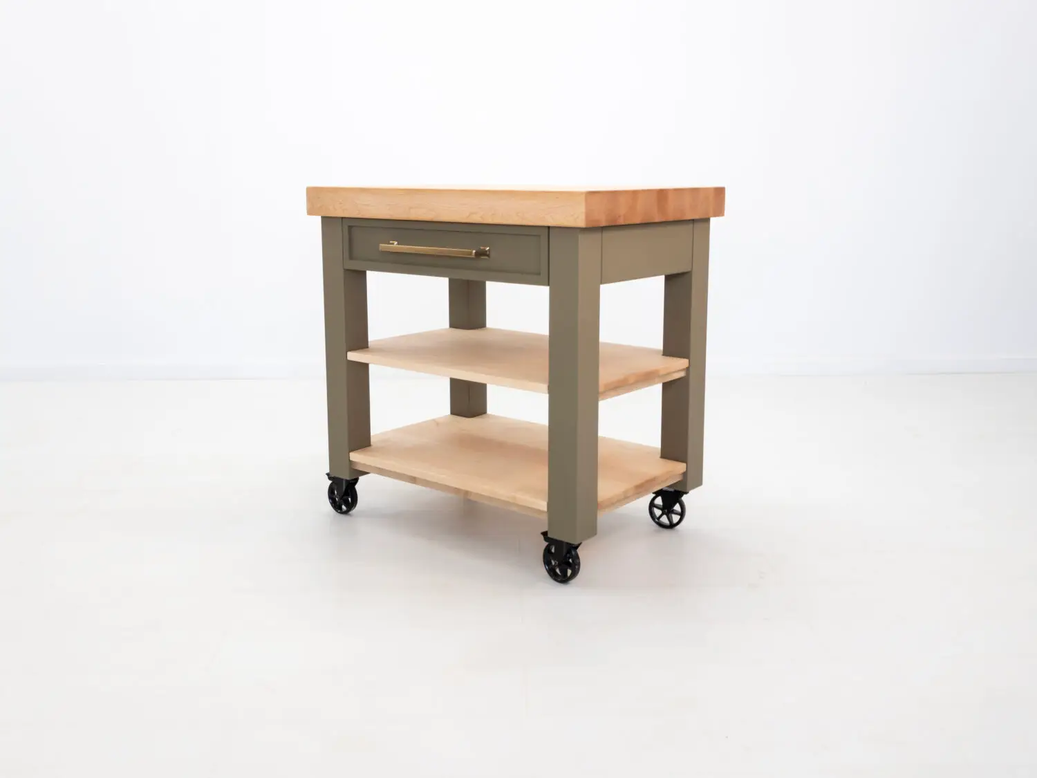 Side view of the CHEF kitchen cart with a spacious utensil drawer and flat black Top Knobs Ascendra pull