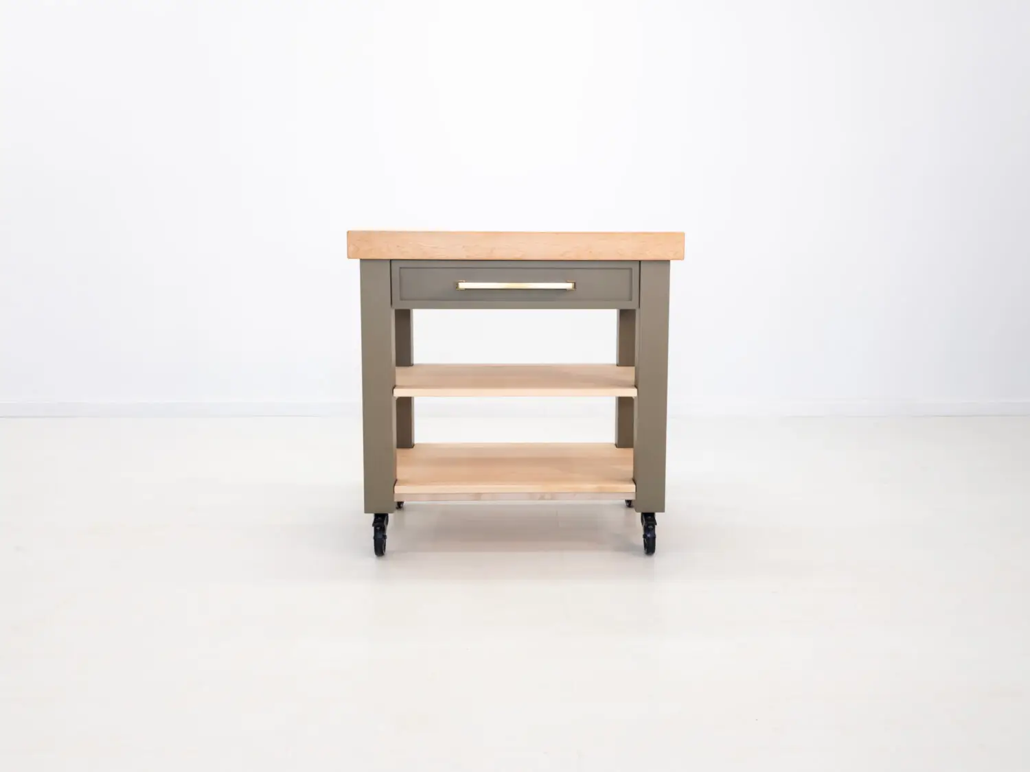 Front view of the CHEF butcher block island featuring a solid maple base and thick edge grain butcher block top