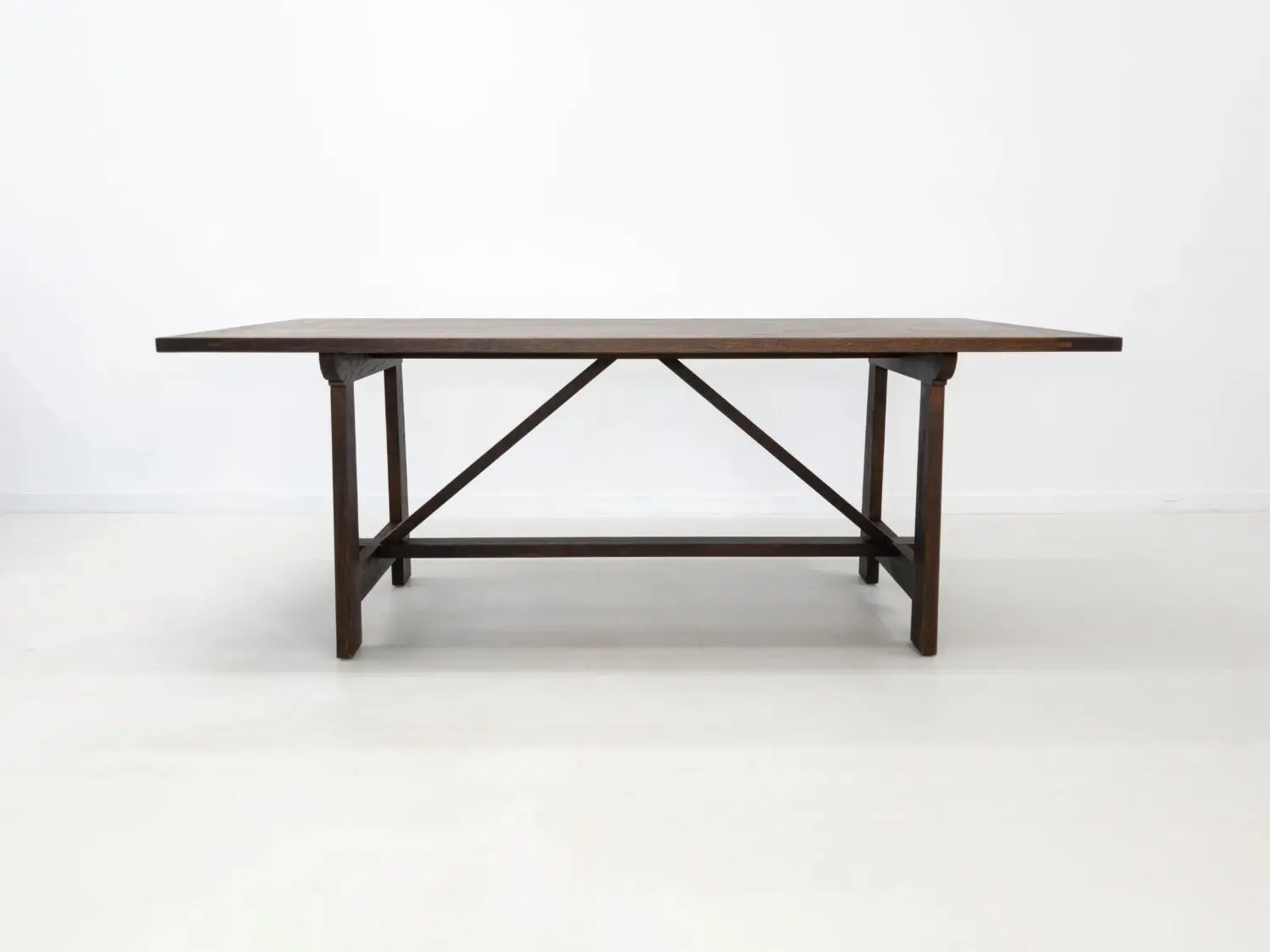 Front view of the EDEN dining table  Solid white oak dining table with breadboard ends and trestle base