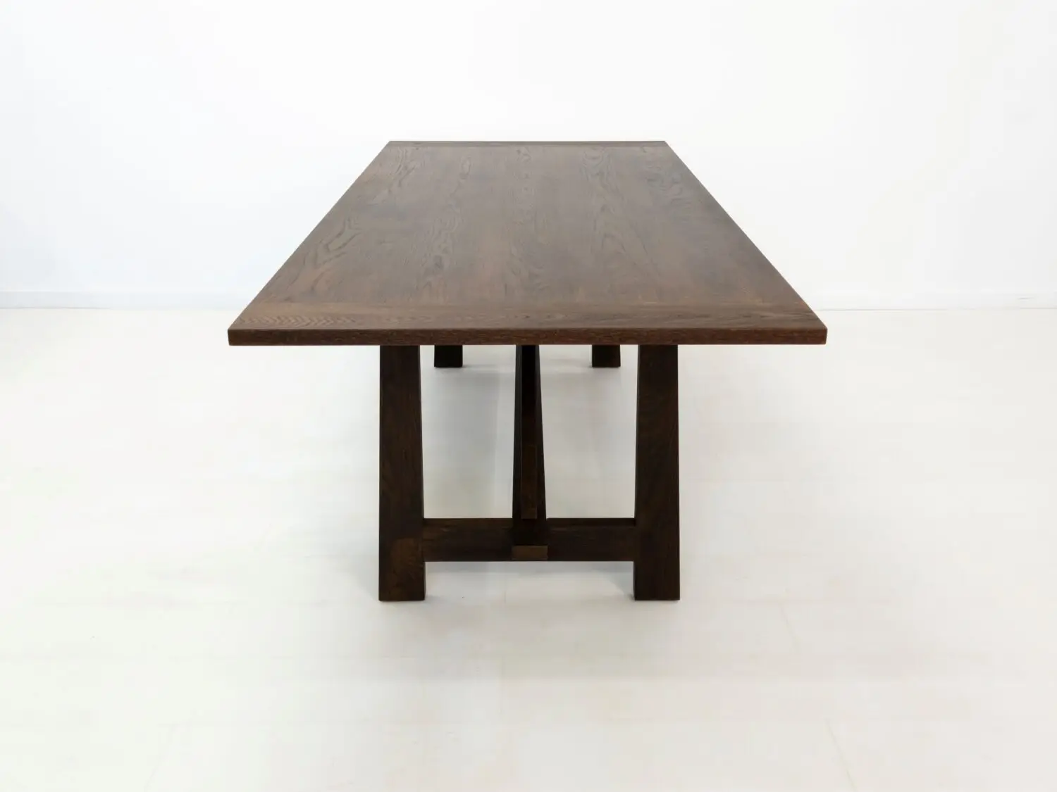 Top down view of the EDEN dining table  Solid wood tabletop with a smooth uninterrupted surface and visible natural grain