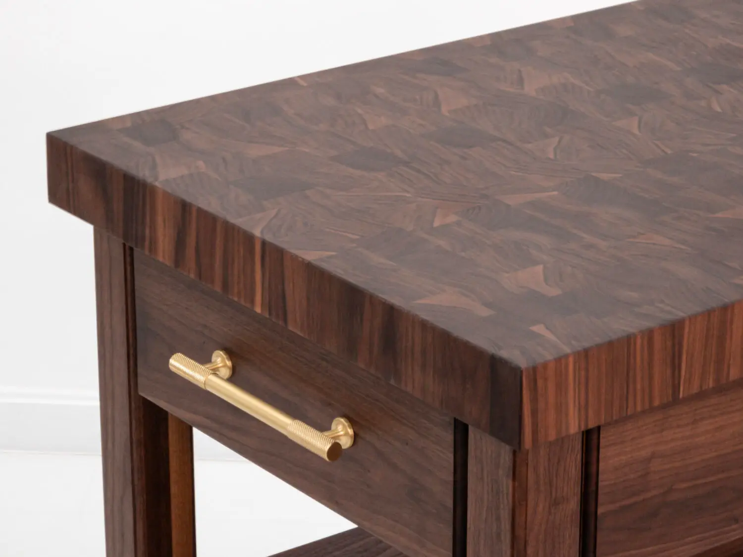 Close up of the 25 inch thick end grain walnut butcher block top showcasing its natural grain and knife friendly surface